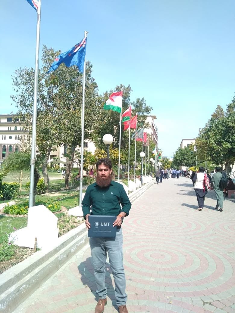At UMT Lahore campus with MS Project Management degree folder